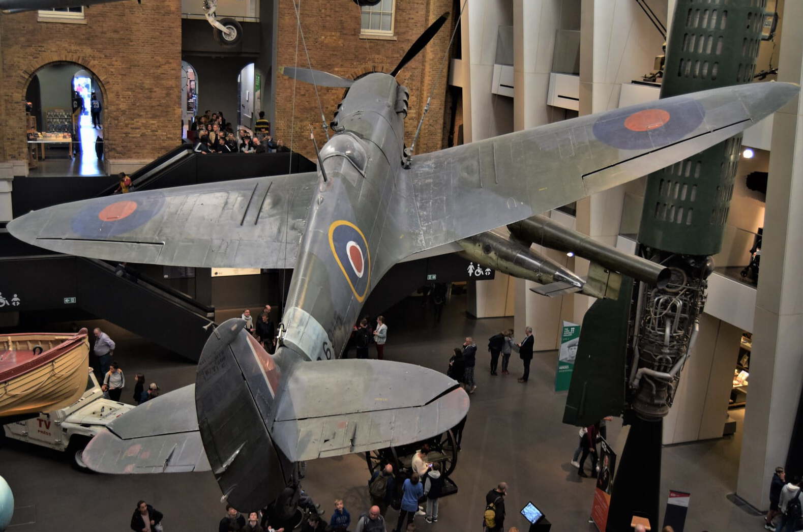A spitfire plane suspended in the entrance hall at the Imperial War Museums, London